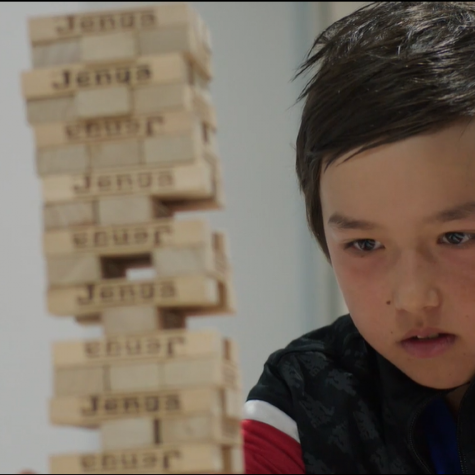 Hugo playing Jenga with frinds