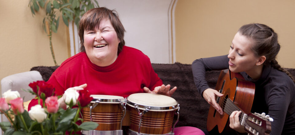 Two women make a music therapy and having fun