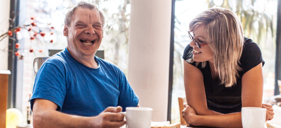 Adult Man Portrait with a Down Syndrome in a Daycare Center