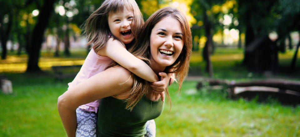 Little girl with special needs enjoy spending time with mother in nature