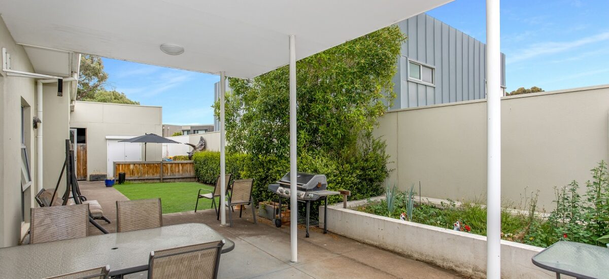 Courtyard with a raised veggie garden, BBQ and sitting area