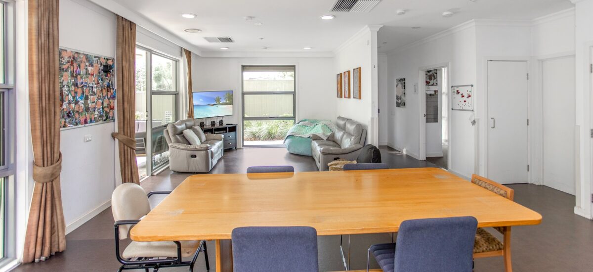 Dining table with chairs and a living room