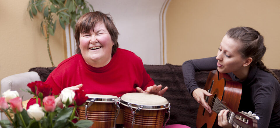 Two women make a music therapy and having fun