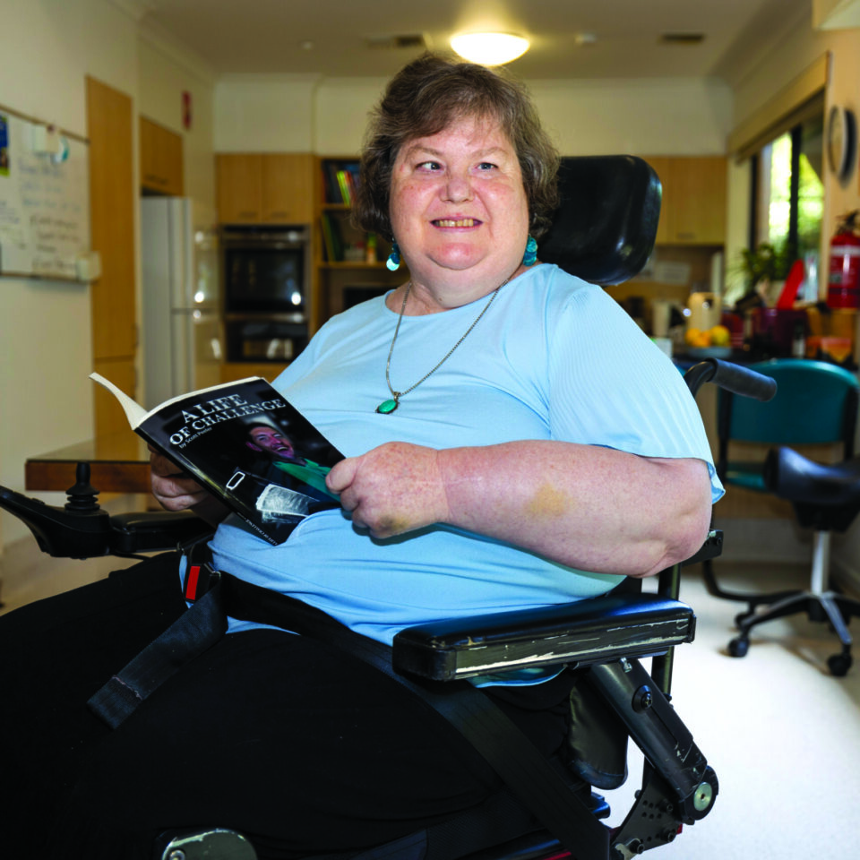 Tracy holding a book